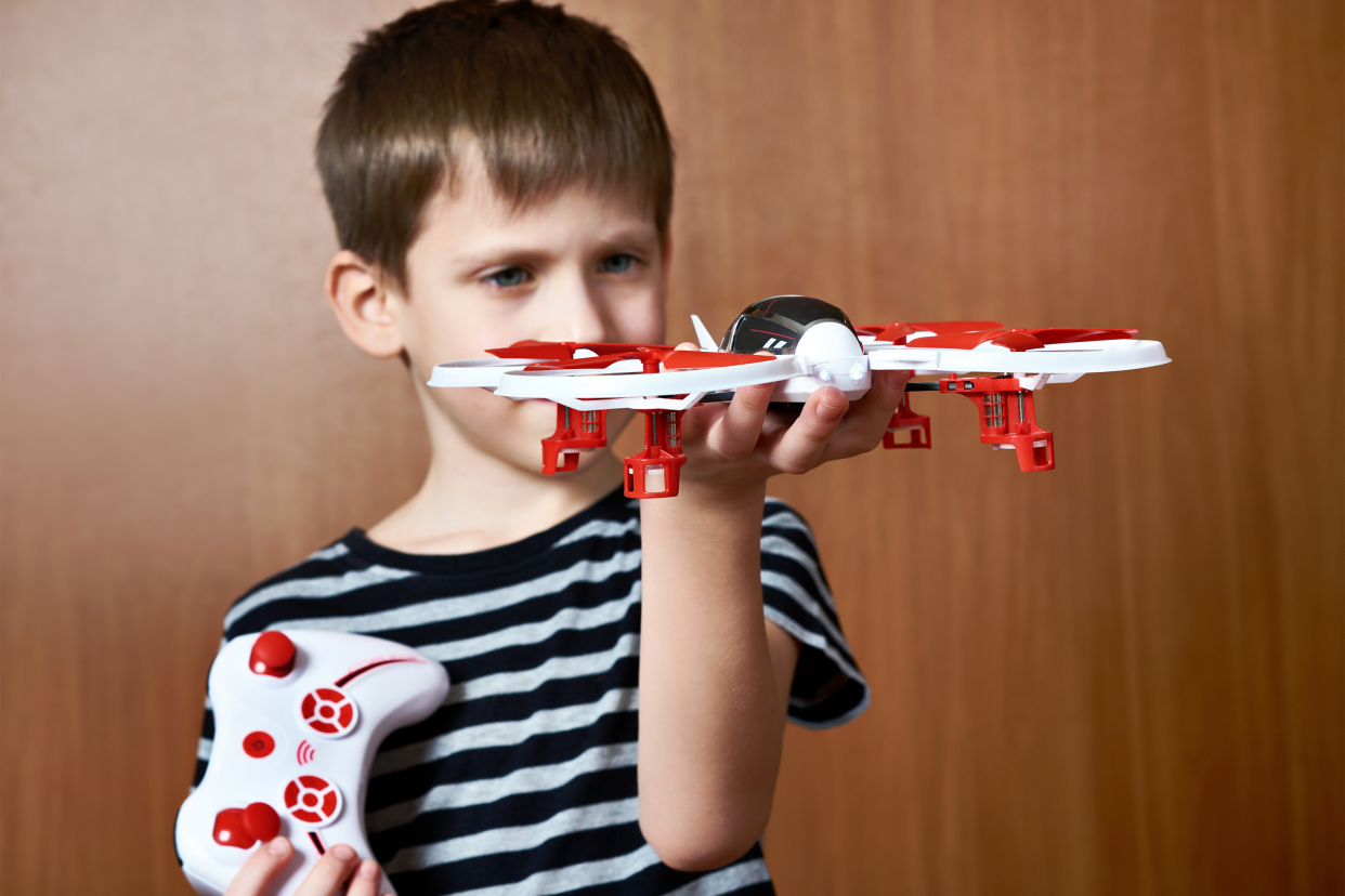 Boy playing with drone