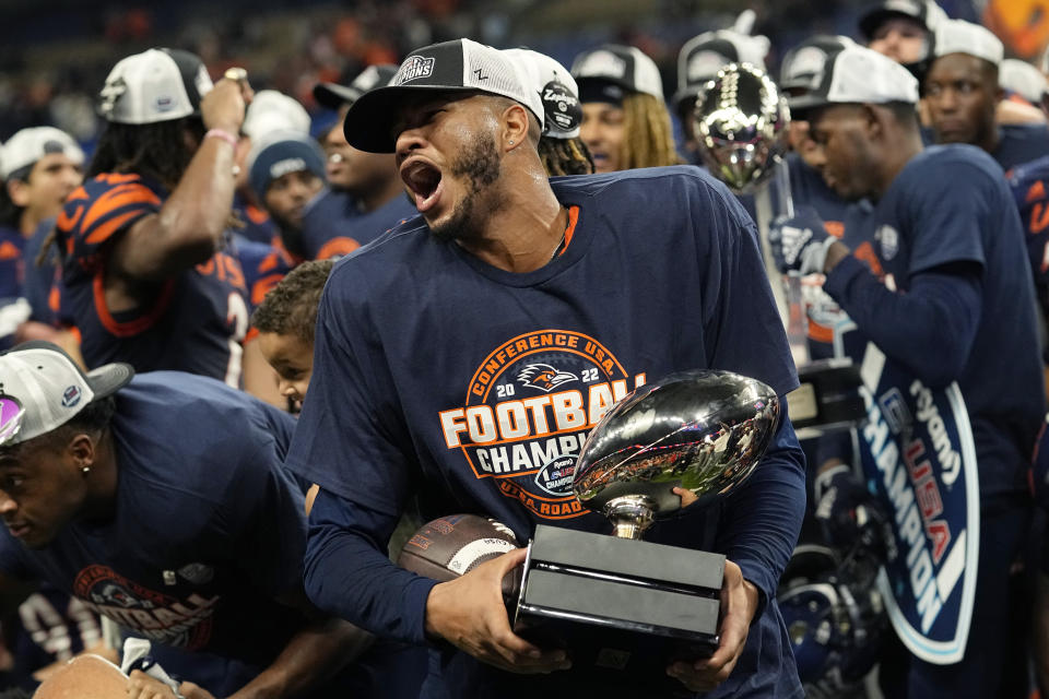 UTSA quarterback Frank Harris, center, celebrates the team's win over North Texas in an NCAA college football game for the Conference USA championship in San Antonio, Friday, Dec. 2, 2022. (AP Photo/Eric Gay)