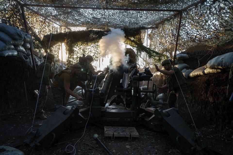 Ukrainian servicemen of 148th separate artillery brigade of the Air Assault Forces fire towards Russian positions by a M777 howitzer at the frontline in Donetsk region (AP)