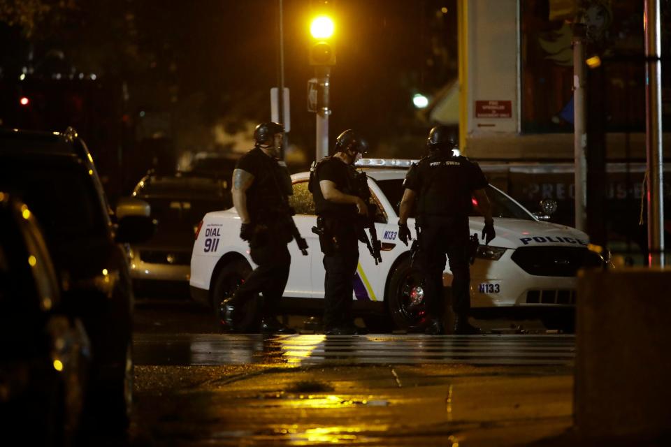 Authorities continue their investigation of a shooting where multiple police officers were shot, Wednesday, Aug. 14, 2019, in Philadelphia. 