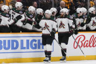Arizona Coyotes center Alexander Kerfoot, front left, celebrates a goal with teammates during the second period of an NHL hockey game against the Nashville Predators, Saturday, Nov. 11, 2023, in Nashville, Tenn. (AP Photo/George Walker IV)