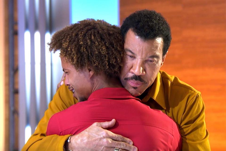 Cam Amen gets a hug from Lionel Richie