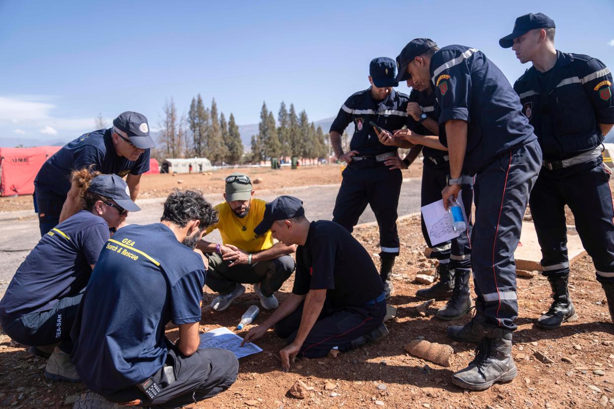 File photo: Moroccan and Spanish emergency units discuss plans at a military camp in the town of Amizmiz (Copyright 2023 The Associated Press. All rights reserved.)