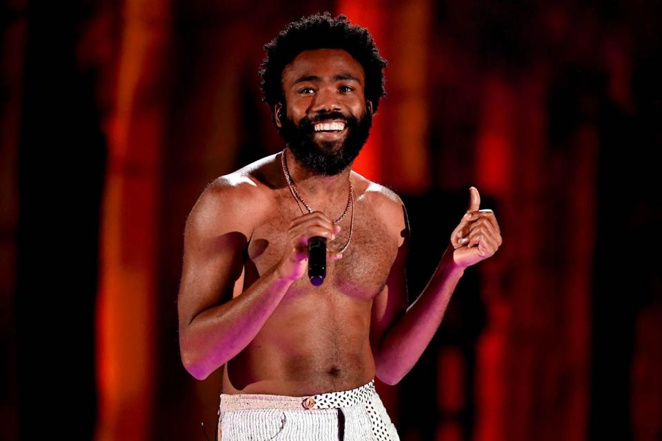 <p>Kevin Winter/Getty </p> Childish Gambino performs onstage during the 2018 iHeartRadio Music Festival at T-Mobile Arena on Sept. 21, 2018 in Las Vegas