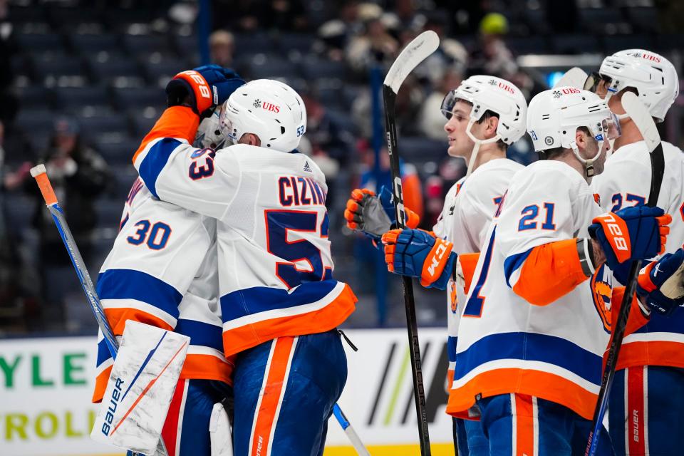 Apr 4, 2024; Columbus, Ohio, USA; The New York Islanders celebrate their 4-2 win over the Columbus Blue Jackets following the NHL hockey game at Nationwide Arena.