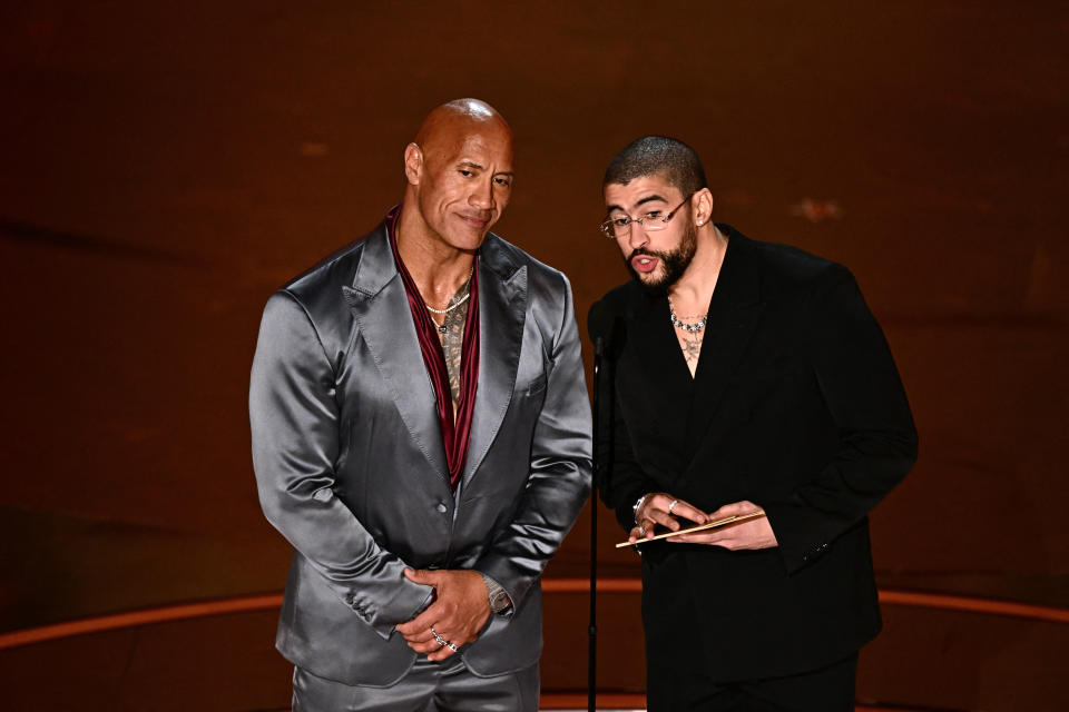 Bad Bunny Rocks A Classic Black Suit & Librarian Glasses at the Oscars 2024