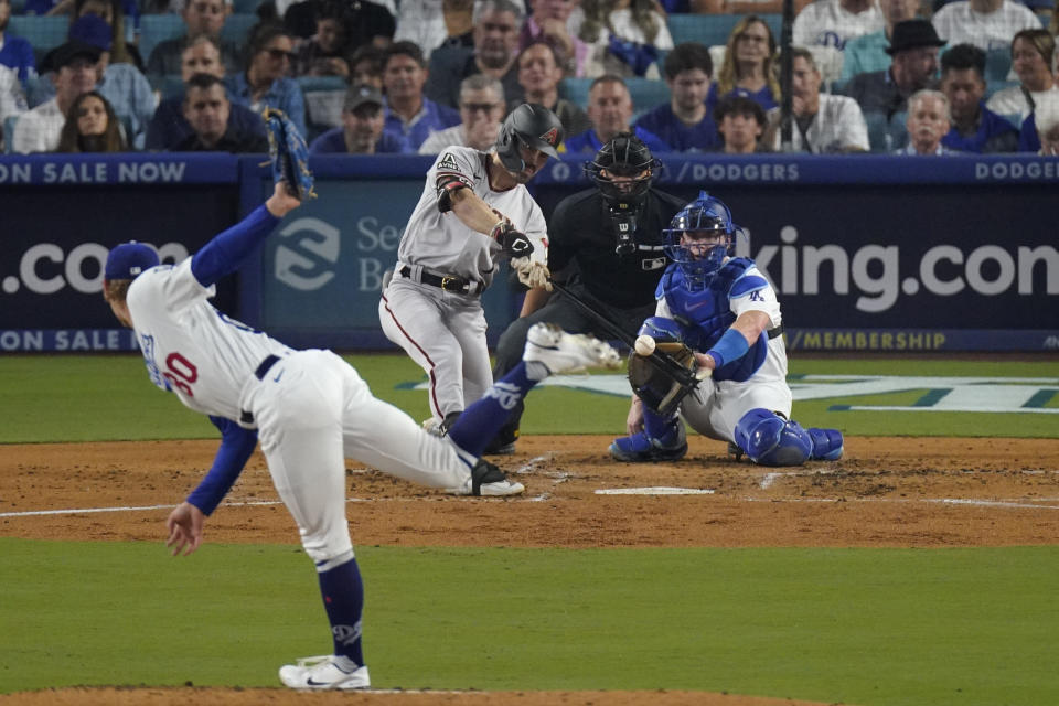 Arizona Diamondbacks' Corbin Carroll hits a home run during the second inning in Game 1 of a baseball NL Division Series against the Los Angeles Dodgers, Saturday, Oct. 7, 2023, in Los Angeles. (AP Photo/Mark J. Terrill)