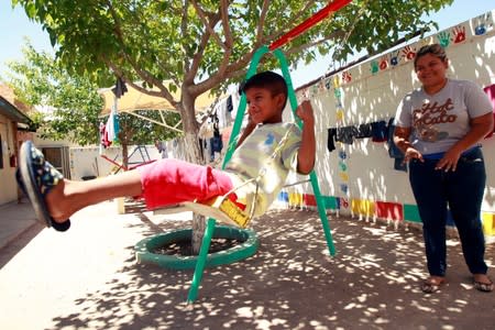 Honduran migrant Denia Carranza, 24, and her son Robert, 7, who have given up their U.S. asylum claim under the Migrant Protection Protocol (MPP), play at Casa del Migrante migrant shelter, in Ciudad Juarez