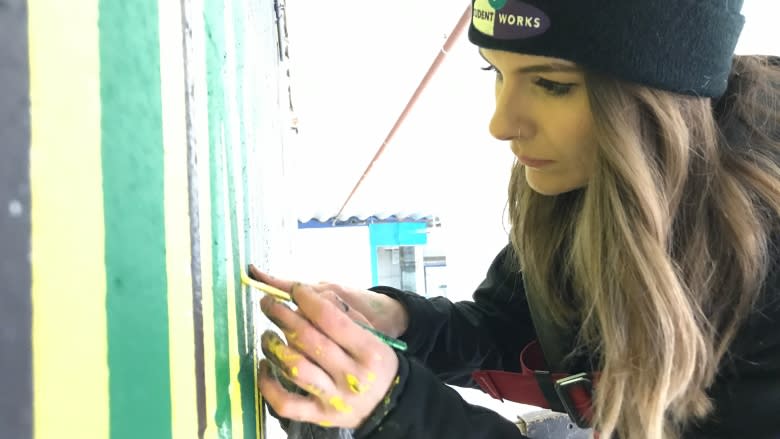 'You have to go on': Saskatoon volunteers paint mural at arena in honour of Humboldt Broncos