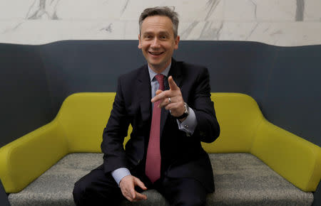 FILE PHOTO: Rio Tinto CEO Jean-Sebastien Jacques reacts as he poses for a photograph prior to the company releasing its 2017 full year results, in London, Britain, February 7, 2018. REUTERS/Peter Nicholls/File Photo