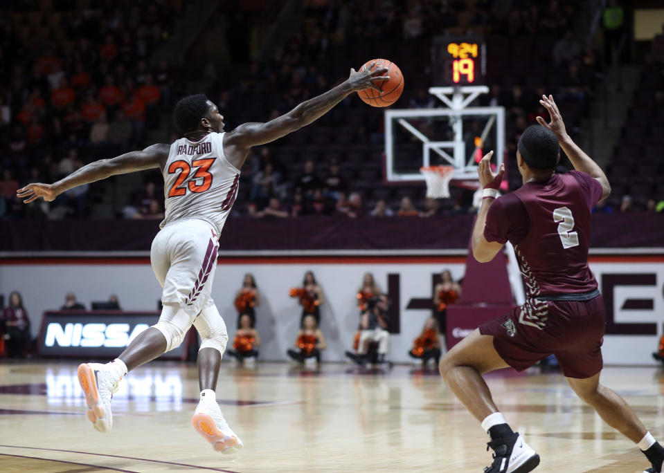 Virginia Tech's Tyrece Radford (23) intercepts a pass intended for Maryland-Eastern Shore's Ty Gibson (2) in the first half of an NCAA college basketball game in Blacksburg, Va., Sunday, Dec. 29 2019. Radford converted the steal for a basket on the play. (Matt Gentry/The Roanoke Times via AP)