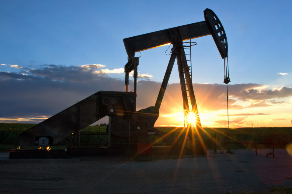 Pump Jack with the sun setting in the background.