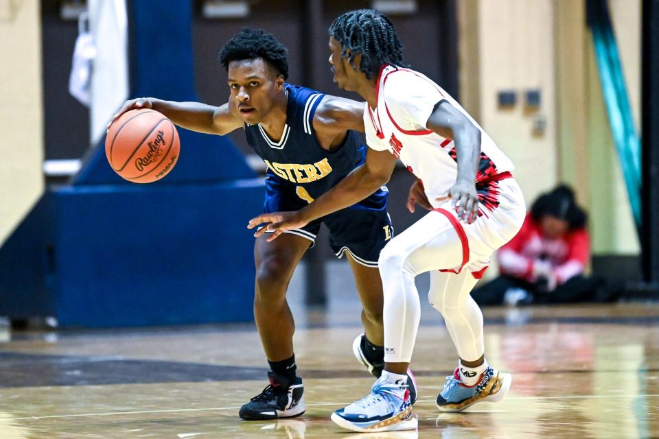 Eastern's KyRen McKnight, left, looks for room as Sexton's Dai’john Chandler defends during the first quarter on Monday, March 6, 2023, at the Don Johnson Fieldhouse Lansing.