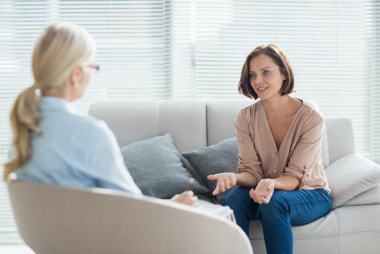 Two women talking, counselling.