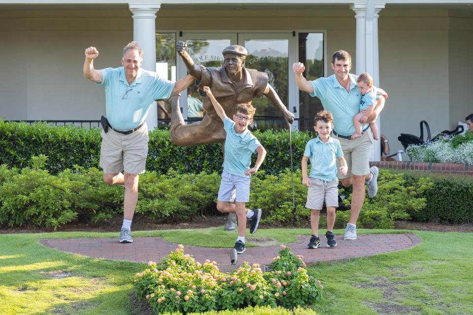 Members of the Vilardi family pose before the Payne Stewart statue in Pinehurst, North Carolina, host site of the U.S. Kids Golf world championships in August. From left: Mario (grandfather), Mario (grandson), Charlie, David and Angelo Vilardi.