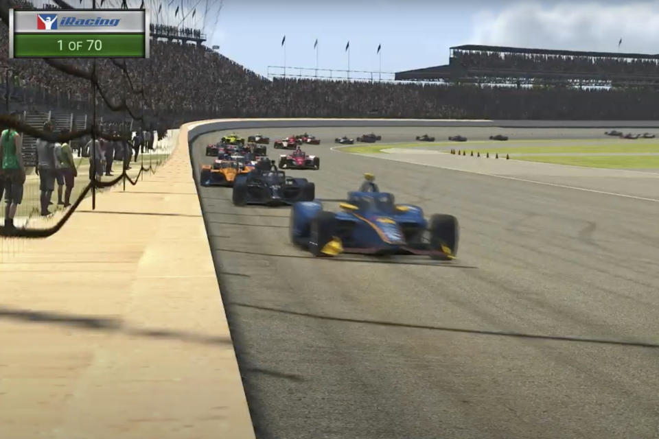 In this image taken from video provided by iRacing IndyCar, driver Scott McLaughlin, front, leads the field during the first lap of the First Responder 175 presented by GMR virtual IndyCar auto race at the Indianapolis Motor Speedway, Saturday, May 2, 2020, in Indianapolis, Ind. (iRacing IndyCar via AP)