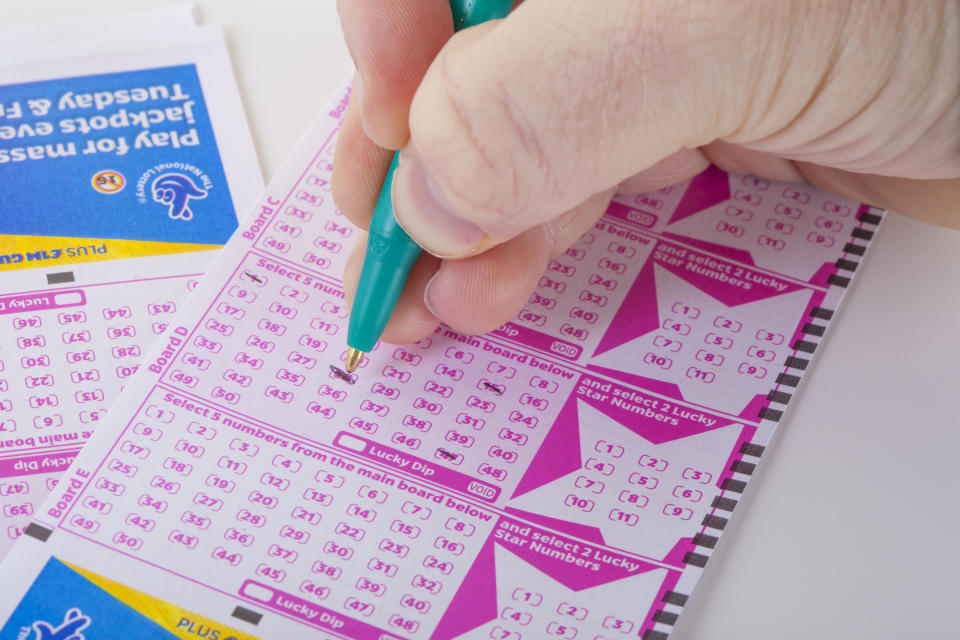 London, United Kingdom - January 07, 2014: A photo of someone choosing lottery numbers in the United Kingdom. The National Lottery is the state-franchised national lottery in the United Kingdom and the Isle of Man.