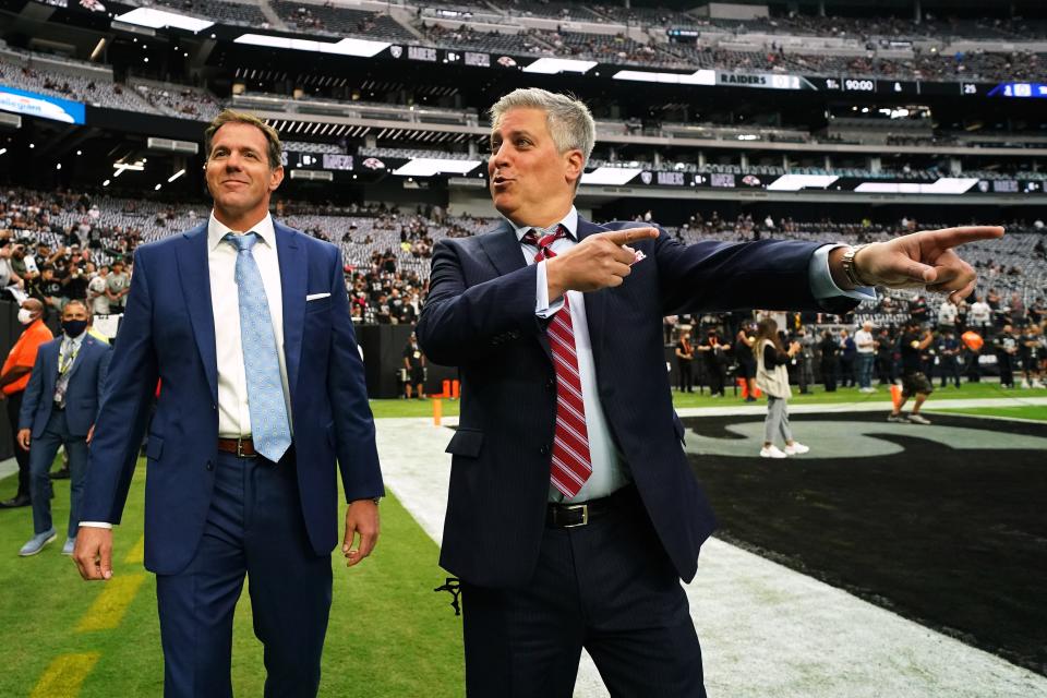 Broadcasters Brian Griese, left, and Steve Levy were down on the field at Allegiant Stadium prior to the first "Monday Night Football" game of the regular season on Sept. 13. The game marked the return of capacity crowds.