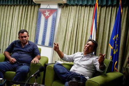 Havana's Housing Provincial Director Euclides Santos (R) speaks during a news conference in Havana, Cuba, September 15, 2017. REUTERS/Alexandre Meneghini