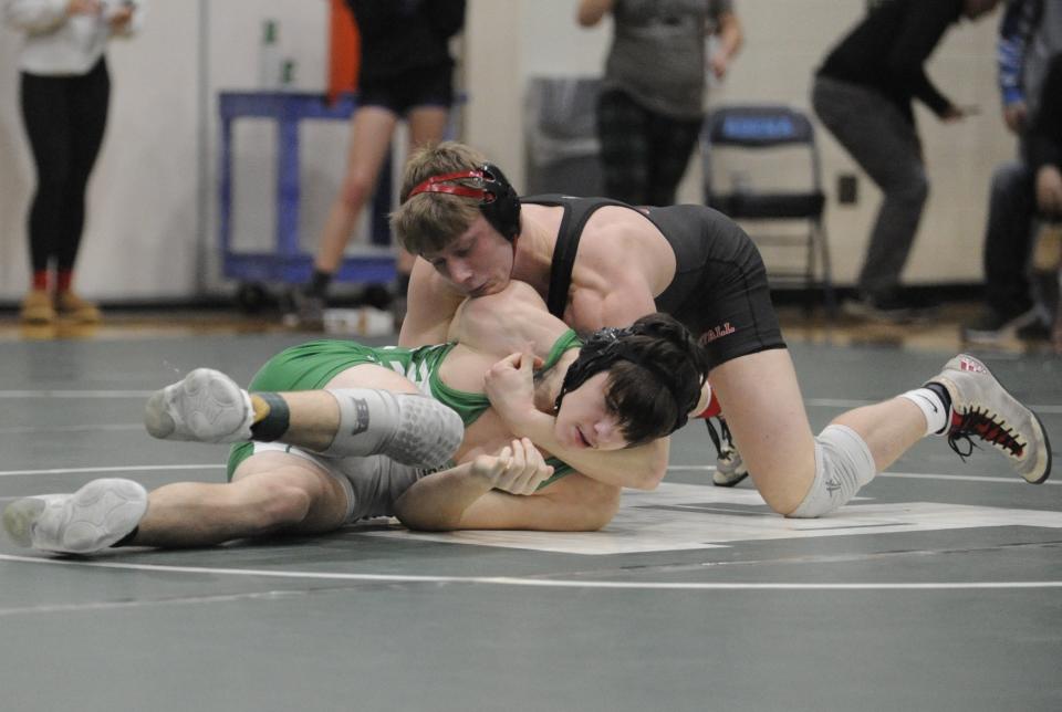 Westfall's Gage Bolt (top) wrestles with Huntington's Carson McNeal during the fifth round of the 165--pound bracket at the Scioto Valley Conference championships in Frankfort, Ohio, on Feb. 10, 2024.