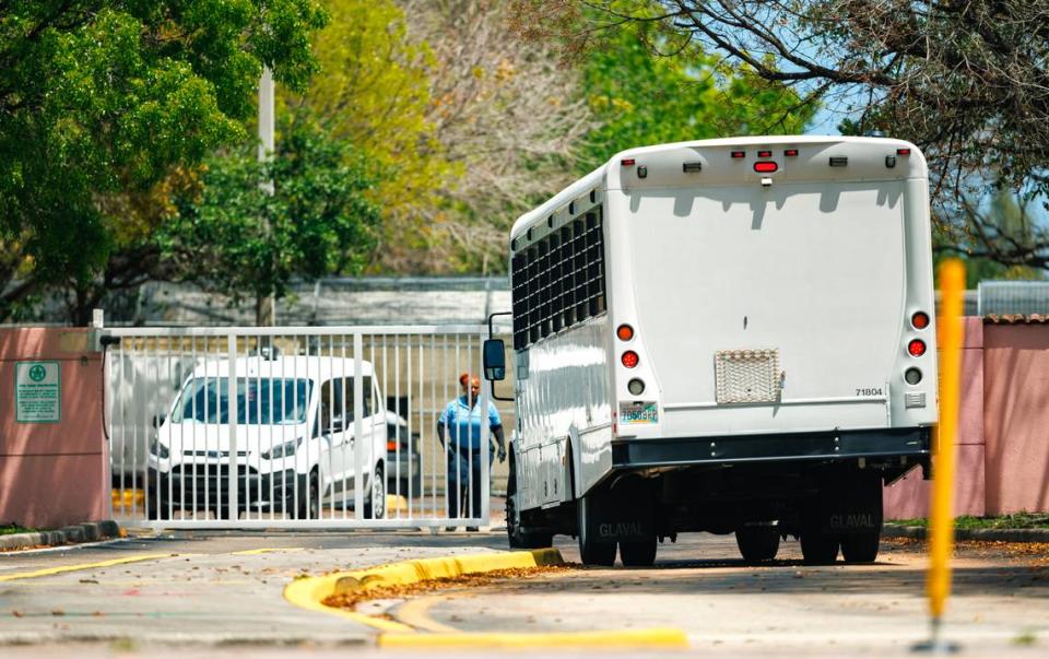 A bus enters the main entrance of the Broward Transitional Center in Pompano Beach, Florida, on Tuesday, April 18, 2023