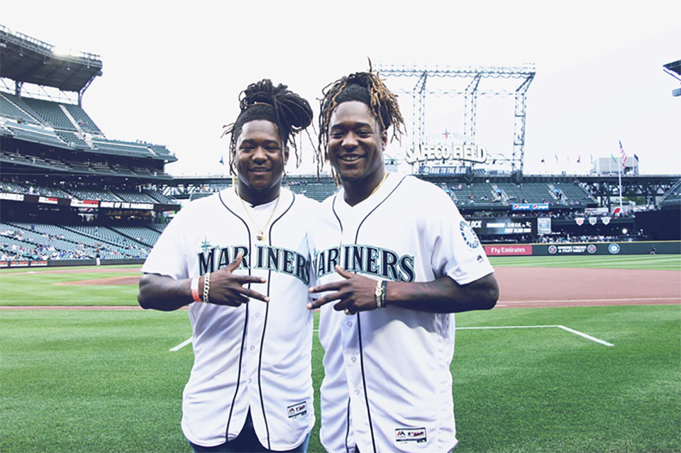 Seahawks linebacker Shaquem Griffin threw out the first pitch at the Mariners game against the Royals on Friday night to his brother, Shaquill. (Twitter/@Seahawks)