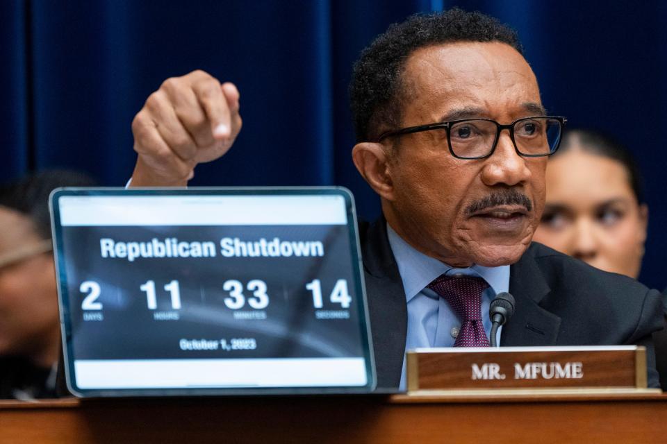 Rep. Kweisi Mfume, D-Md., points to a countdown clock with the time left before a government shutdown, during a House Oversight Committee impeachment inquiry into President Joe Biden, Thursday, Sept. 28, 2023, on Capitol Hill in Washington.