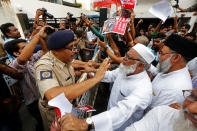 <p>A police officer tries to stop a demonstrator of Students Islamic Organisation of India (SIO) from breaking a police barricade during a protest rally against what the demonstrators say are killings of Rohingya people in Myanmar, near Myanmar consulate in Kolkata, India, Sept. 7, 2017. (Photo: Rupak De Chowdhuri/Reuters) </p>