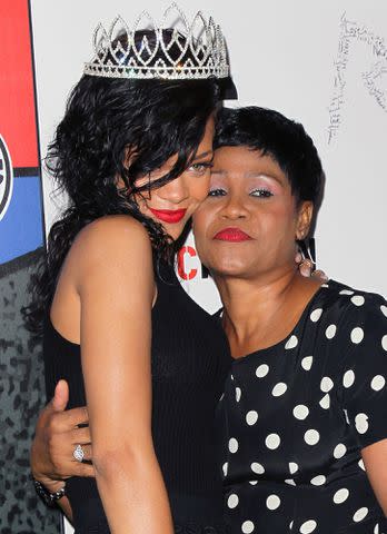 <p>David Livingston/Getty </p> Rihanna with her mother, Monica Braithwaite, at the West Hollywood Halloween Carnaval in 2012.