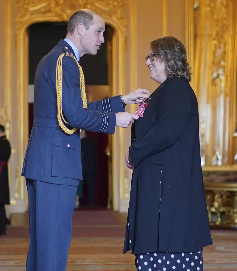 Karen Steen, Executive Head Teacher of Falkland Islands Schools, right, is made a Member of the Order of the British Empire by Britain's Prince William, Prince of Wales, at Windsor Castle, Windsor, England, Wednesday, Feb. 7, 2024. (Yui Mok/PA via AP)