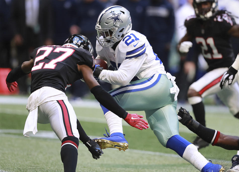 Dallas Cowboys running back Ezekiel Elliott plows through Atlanta Falcons safety Damontae Kazee on his way to the end zone and a touchdown during the fourth quarter of an NFL football game Sunday, Nov. 18, 2018, in Atlanta. Dallas won 22-19. (Curtis Compton/Atlanta Journal-Constitution via AP)