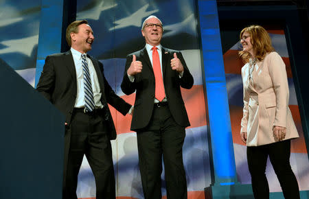 Representative Kevin Cramer (R-ND) with his wife Kris and state GOP chairman Rick Berg (L) attend the 2018 North Dakota Republican Party Convention in Grand Forks, North Dakota, U.S. April 7, 2018. Picture taken April 7, 2018. The party endorsed Cramer for the U.S. Senate race against Democratic Sen. Heidi Heitkamp. REUTERS/Dan Koeck