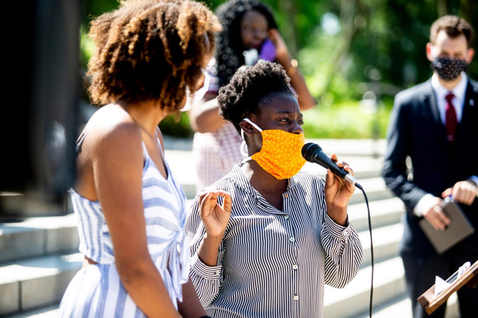 Image: Yena Ana Balekyani speaks to reporters outside the Iowa State Capitol in Des Moines, Iowa, on June 4, 2020. (Kelsey Kremer / The Register via USA-Today Network)