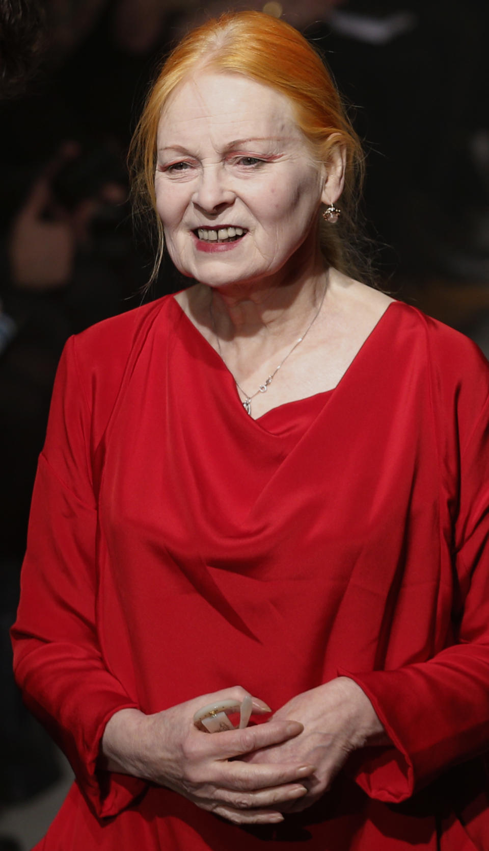 Designer Vivienne Westwood accepts applause after her Fall/Winter 2013-2014 ready to wear collection, presented in Paris, Saturday, March 2, 2013. (AP Photo/Christophe Ena)