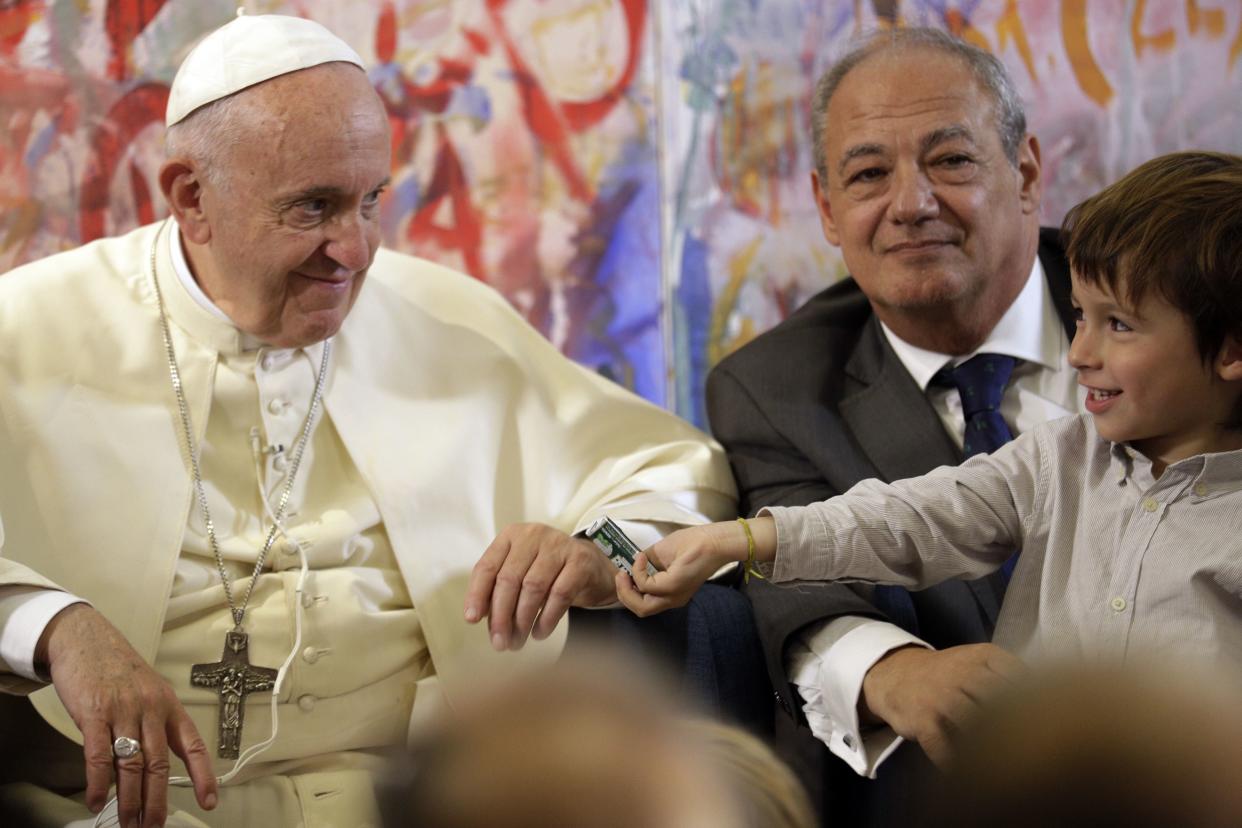 Pope Francis (L) looks at a child as he attends a meeting with members of the Scholas Occurrentes initiative, in Palazzo San Calisto in Rome on October 26, 2017. (Photo: ANDREW MEDICHINI via Getty Images)