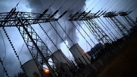 FILE PHOTO: Water vapour rises from the cooling towers of the Jaenschwalde lignite-fired power plant of Lausitz Energie Bergbau AG (LEAG) in Jaenschwalde