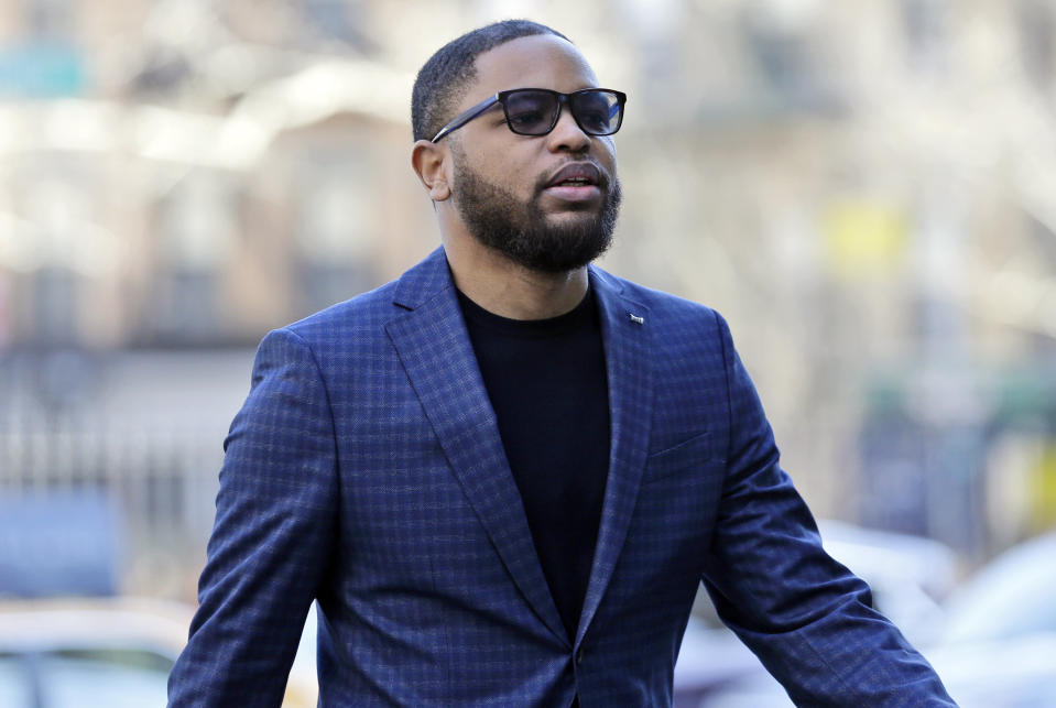 FILE - In this March 5, 2019, file photo, Christian Dawkins arrives at federal court in New York. A prosecutor says greed led a fledgling manager of basketball players to bribe college coaches but defense lawyers say it was all an FBI setup. The characterizations came during opening statements Tuesday, April 23, 2019, in the second trial to result from a prosecution that has exposed a seedy side of college basketball recruitment. On trial are business manager Christian Dawkins and ex-amateur league director Merl Code. (AP Photo/Seth Wenig, File)