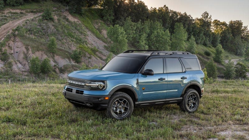 Blue Ford Bronco Sport parked in a field