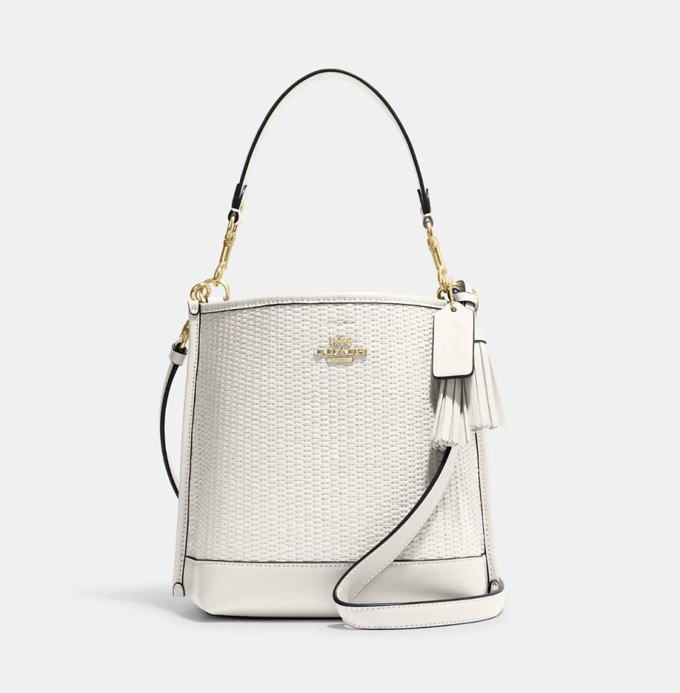 white leather bucket bag from coach outlet, Mollie Bucket Bag 22 in Straw (Photo via Coach Outlet)