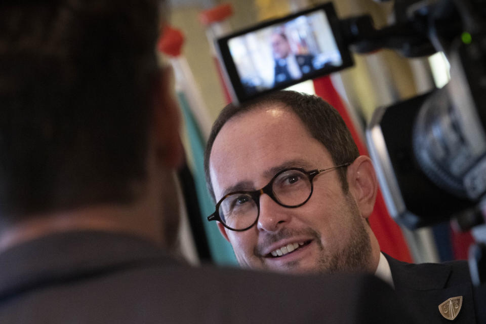 Belgium's Justice Minister Vincent Van Quickenborne is interviewed in Amsterdam, Netherlands, Friday, Oct. 7, 2022, after ministers and delegates from six European nations met to discuss ways of stepping up the fight against organized crime that they warn is undermining society. (AP Photo/Peter Dejong)