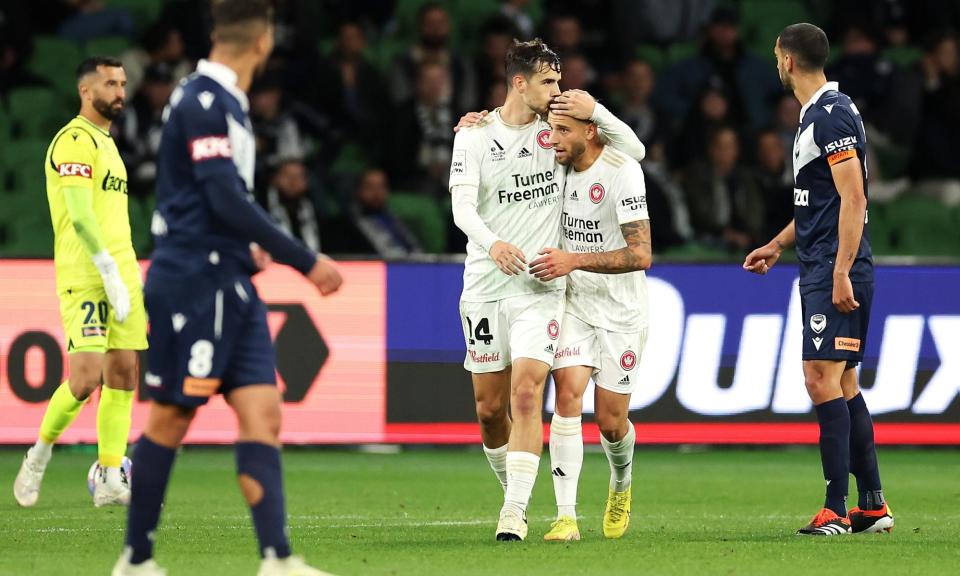 <span>Nicolas Milanovic of the Wanderers celebrates with Dylan Pierias after scoring in the Wanderers’ A-League Men win over Melbourne Victory.</span><span>Photograph: Robert Cianflone/Getty Images</span>