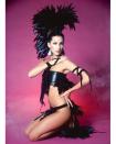 <p>Modeling a black feathered and leather Bob Mackie design. </p>