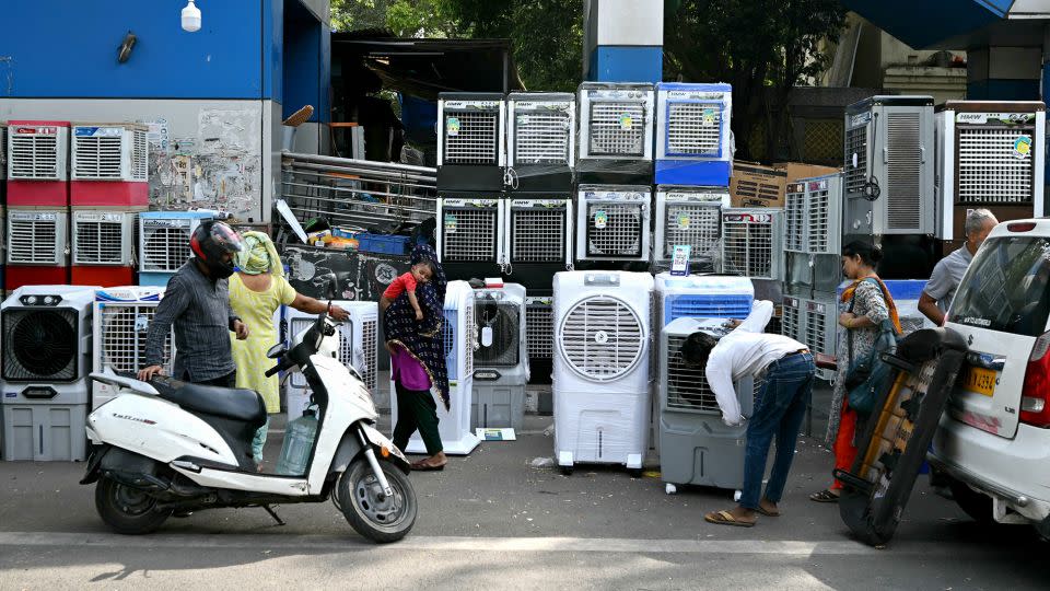 People buy air coolers from a roadside vendor on a hot summer afternoon in New Delhi, India on May 20, 2024, during a brutal heat wave. - Money Sharma/AFP/Getty Images