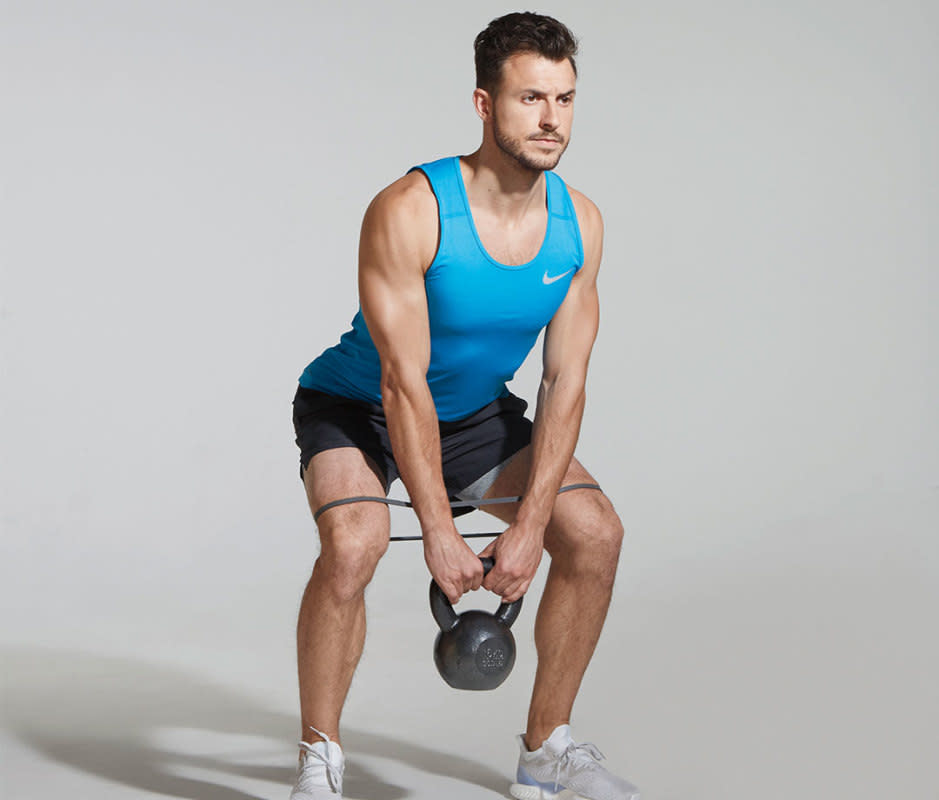 How to do it:<ol><li>Place a band around thighs, just above knees, and stand with feet just wider than shoulder-width apart, holding a moderate (30–40 pound) kettlebell in both hands.</li><li>Hinge at hips and push butt back as you lower your torso and KB toward the floor, maintaining tension in your hamstrings and glutes.</li><li>Push through heels to stand.</li><li>Perform 2 sets of 8 to 10 reps.</li></ol>Target areas:<ul><li>hamstrings</li><li>glutes</li><li>quads</li></ul>Pro tip:<p>Keep you head elevated so your back doesn't arch.</p>Variation:<p>This move can be done with dumbbells in each hand, with a barbell, or as a warm-up to a traditional deadlift.</p>