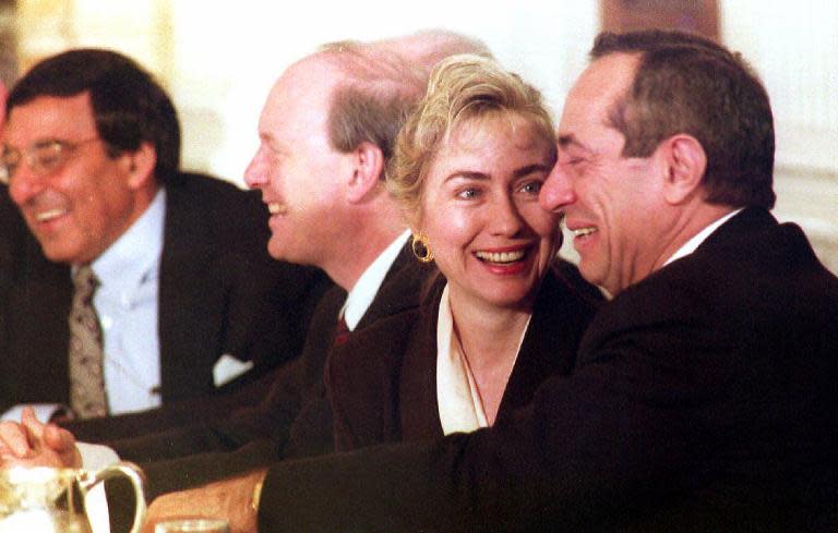 Then US first lady Hillary Clinton smiles at then New York Governor Mario Cuomo (R) February 1, 1993 during a meeting