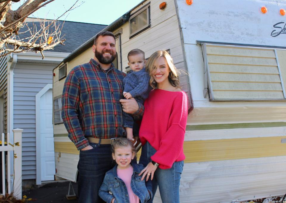 Somerset resident Libby Reilly poses with husband Shane and their kids in front of the 1975 Shasta Starflyte trailer that will become home to her upcoming mobile bookstore, Buster's Bookhouse.