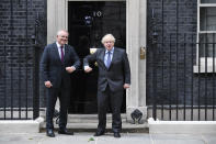 Britain's Prime Minister Boris Johnson, left, greets Australia's Prime Minister Scott Morrison at 10 Downing Street, in London, Monday, June 14, 2021. Johnson and his Australian counterpart Morrison had reached agreement on a free trade deal during negotiations in London, which will be released later Tuesday, June 15, 2021, Australian Trade Minister Dan Tehan said. (AP Photo/Alberto Pezzali)