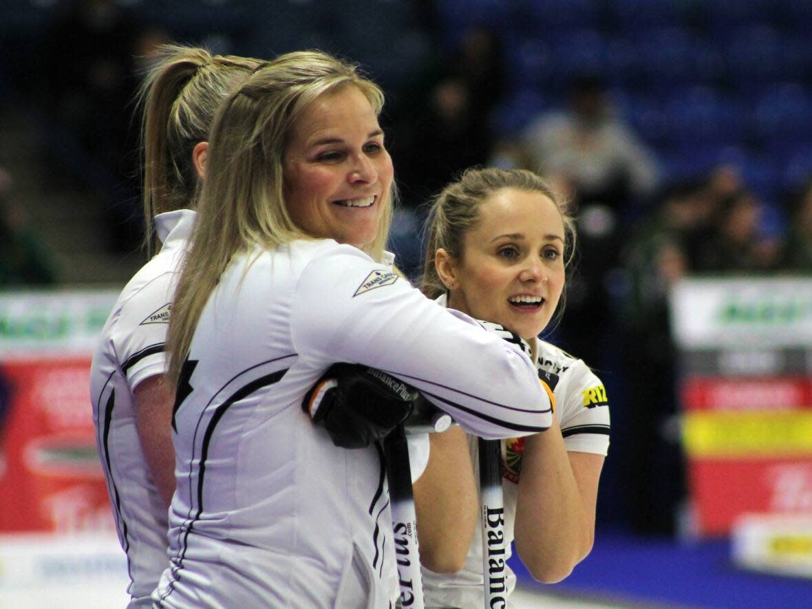 Manitoba skip Jennifer Jones, centre, and her teammate Jocelyn Peterman are competing at the 2021 Canadian Curling Trials in Saskatoon. 'There's a youth bonspiel here, so you're seeing a lot of young teams,' she says.  (Peter Mills/CBC - image credit)