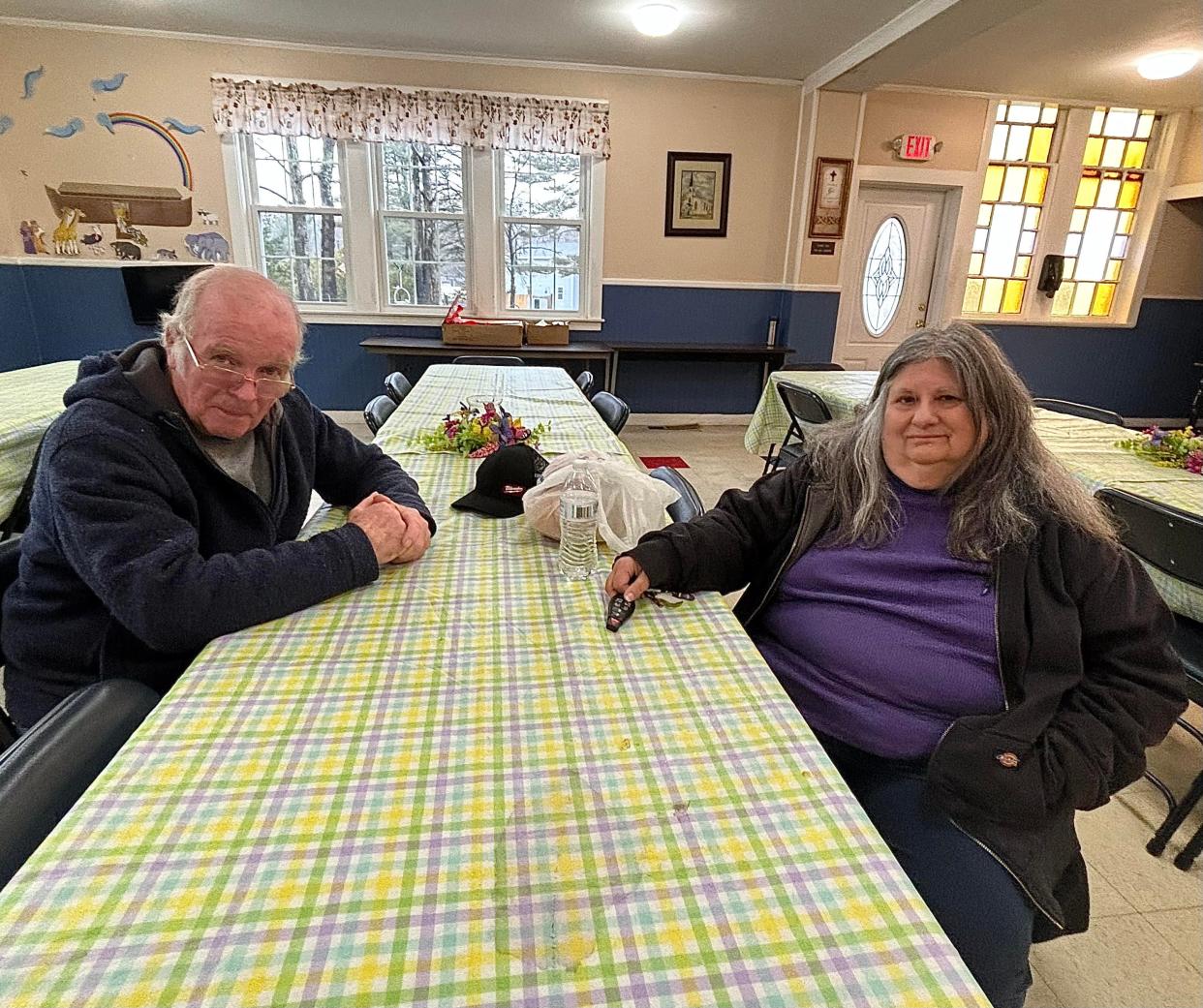 The Rev. John Coppinger and food pantry volunteer Ellen Hurteau are seen here on Saturday, March 23, 2024, inside Fellowship Hall of North Baptist Church in Taunton.