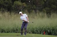 Jan 5, 2019; Maui, HI, USA; PGA golfer Rory McIlroy hits a chip shot on the 15th hole during the third round of the Sentry Tournament of Champions golf tournament at Kapalua Resort - The Plantation Course. Mandatory Credit: Brian Spurlock-USA TODAY Sports